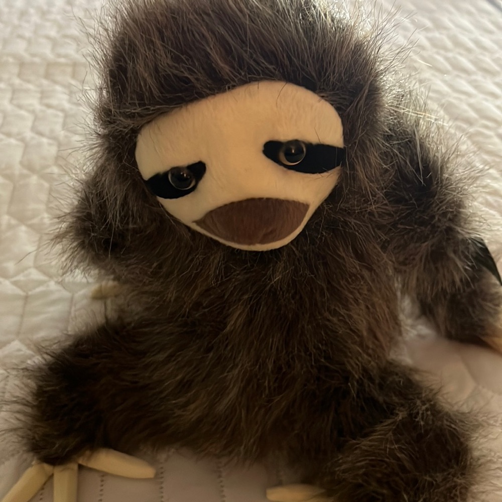 Fiesta plush sloth from WWF Adoption. No rips, tears, or stains.